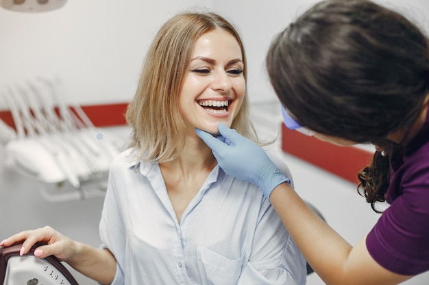 Beautiful girl sitting in the dentist's office