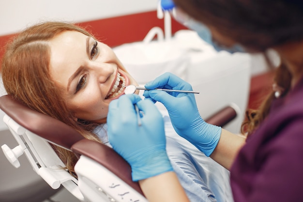 Beautiful girl sitting in the dentist's office