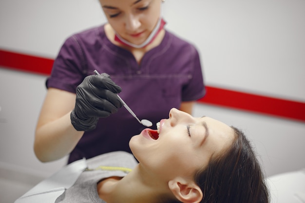 Beautiful girl sitting in the dentist's office