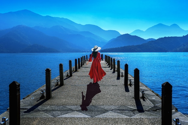 Beautiful girl walking at Sun Moon Lake in Taiwan.