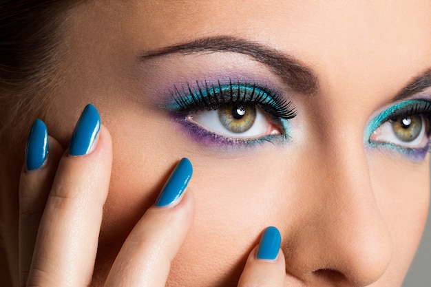 Beautiful girl with colorful makeup