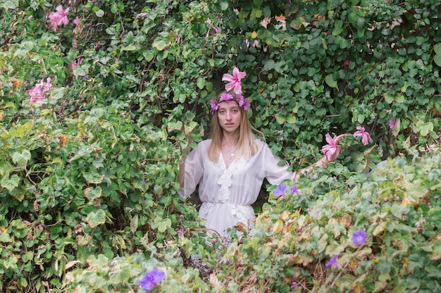 Free Photo beautiful girl with floral wreath posing