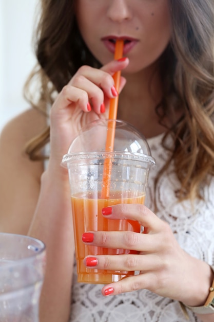 Beautiful girl with orange juice