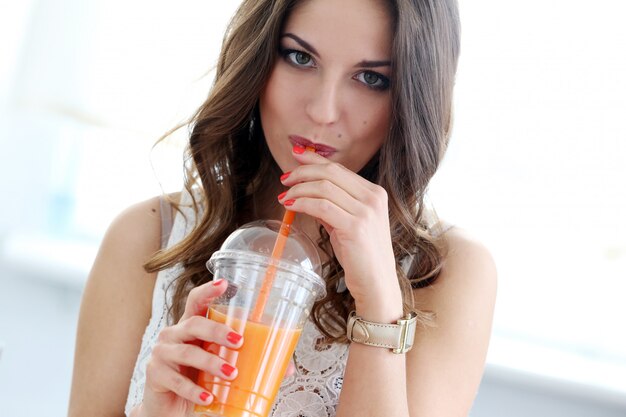 Beautiful girl with orange juice