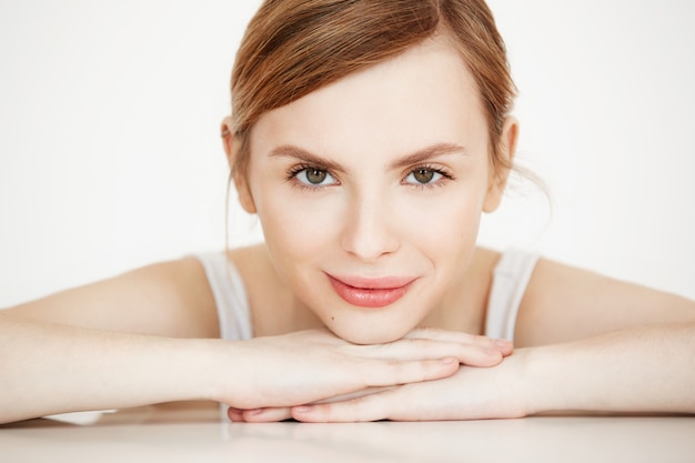 Free Photo beautiful girl with perfect clean skin smiling sitting at table . beauty spa and cosmetology.