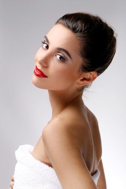 Beautiful girl with perfect skin and red lipstick