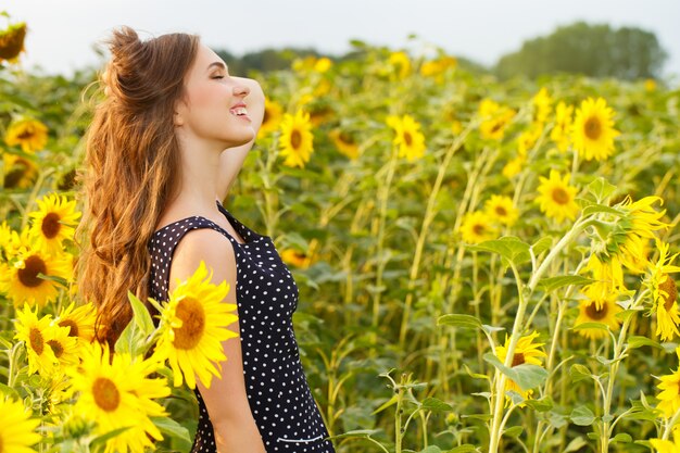 Beautiful girl with sunflowers