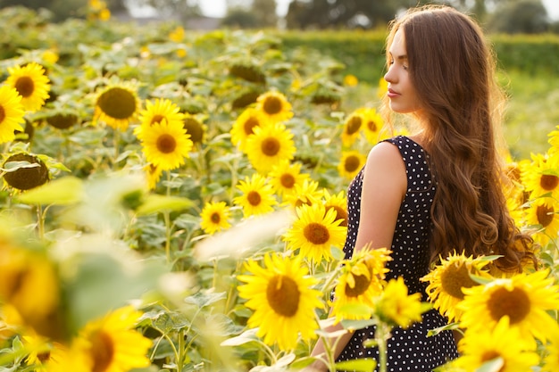 Beautiful girl with sunflowers