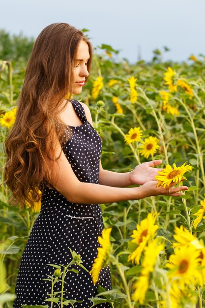 Beautiful girl with sunflowers