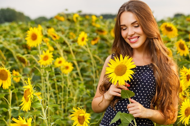 Beautiful girl with sunflowers