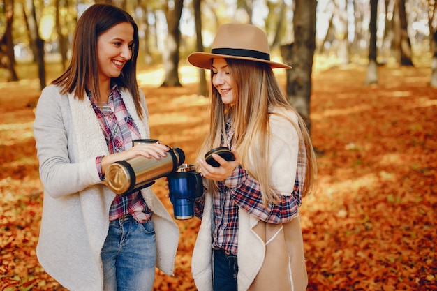 Free photo beautiful girls have fun in a autumn park