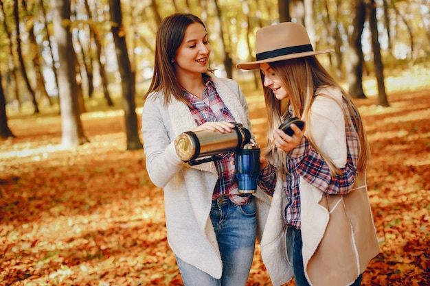 Free photo beautiful girls have fun in a autumn park