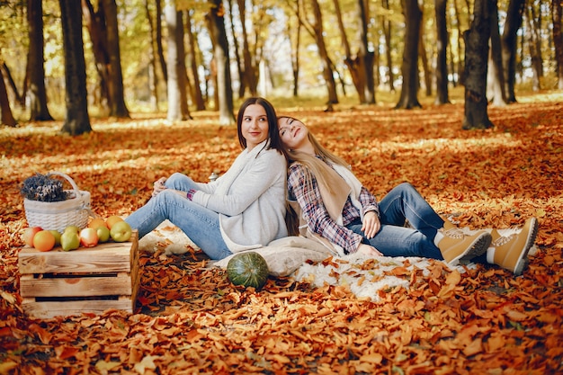 Free photo beautiful girls have fun in a autumn park