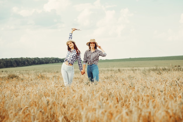 Free photo beautiful girls have a rest in a field