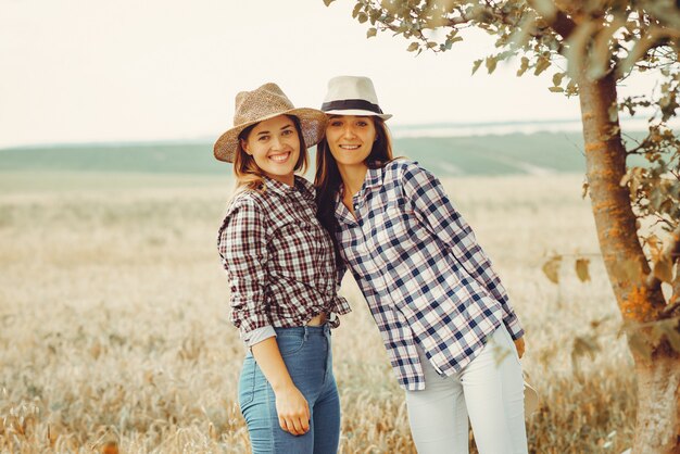 Beautiful girls have a rest in a field