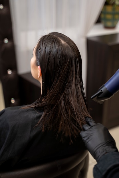 Beautiful hair in the process of keratin treatment