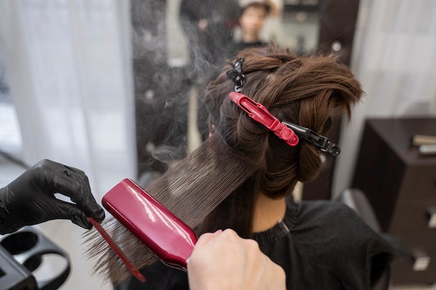 Beautiful hair in the process of keratin treatment