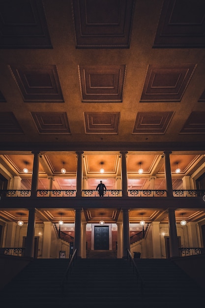 Beautiful hall with a male silhouette standing on a stairway