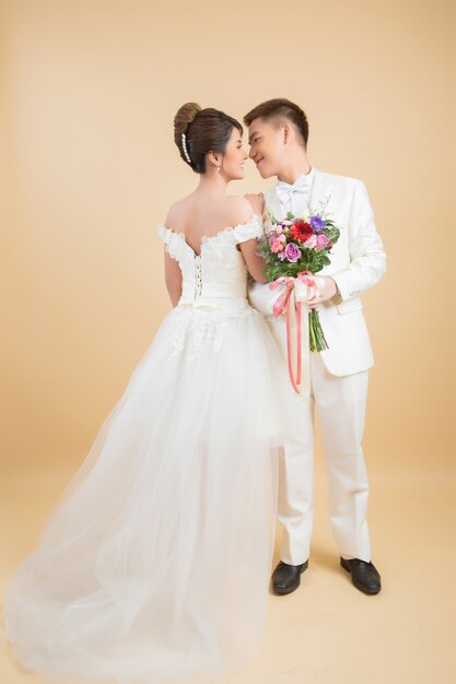 Beautiful happy couple in wedding in studio