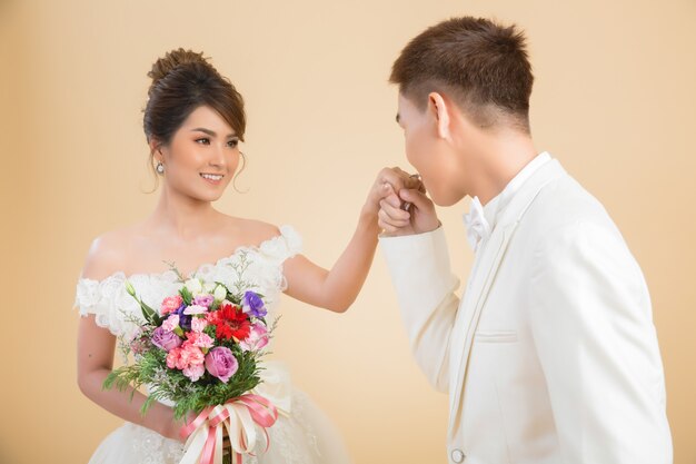 Beautiful happy couple in wedding in studio