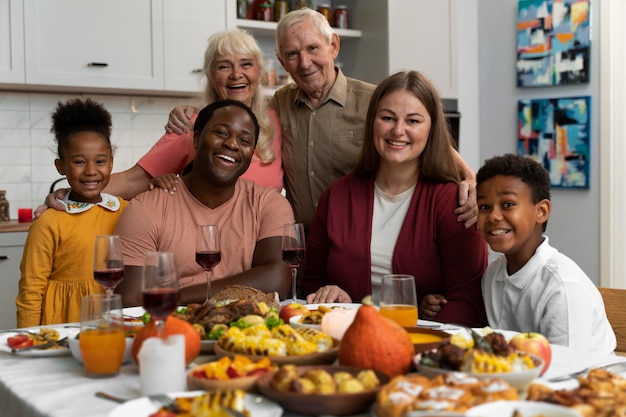 Free photo beautiful happy family having a thanksgiving dinner together