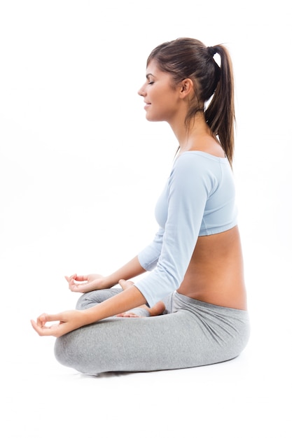 Beautiful healthy young woman doing exercise