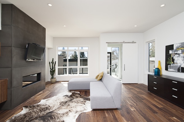 Beautiful interior shot of a modern house with white relaxing walls and furniture and technology