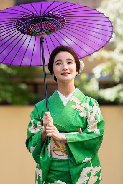 Beautiful japanese woman with a purple umbrella