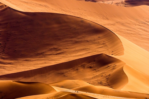 Beautiful landscape of orange sand dune orange sand at Namib desert in Namib-Naukluft national park Sossusvlei in Namibia.