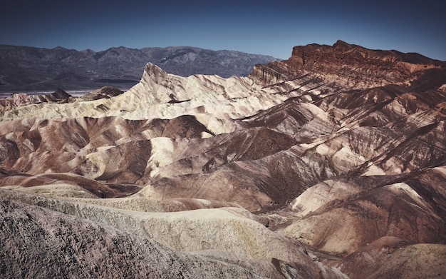 Beautiful landscape shot of white and brown slopes on a rocky mountain during the day