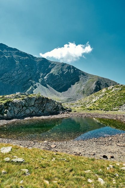 Beautiful landscape view of a small lake surrounded by mountains in a valley of the French Riviera