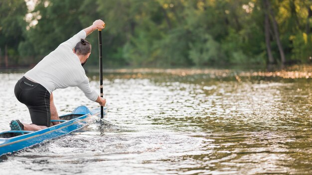 Beautiful landscape with man paddling