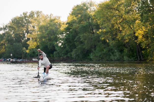 Free photo beautiful landscape with man rowing