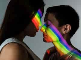 Free photo beautiful lesbian couple with lgbt symbol