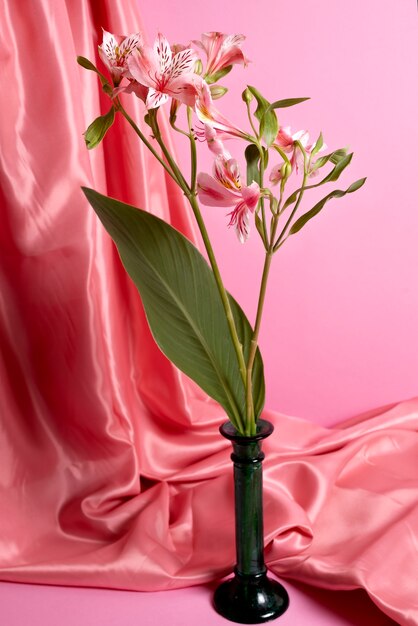 Beautiful lilies with pink background and cloth