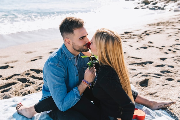 Free photo beautiful loving couple with rose