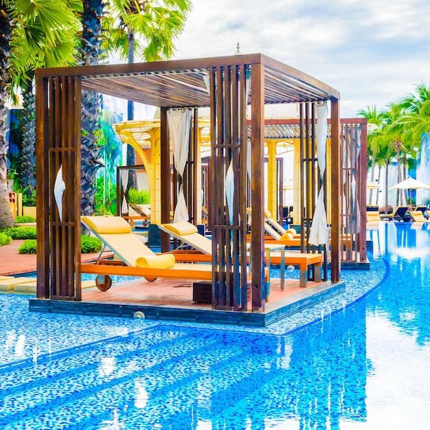 Free photo beautiful luxury swimming pool with outdoor deck in hotel resort