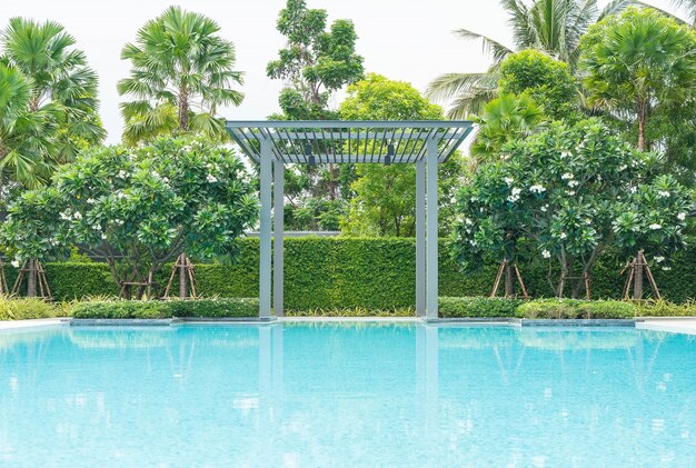 Beautiful luxury swimming pool with palm tree