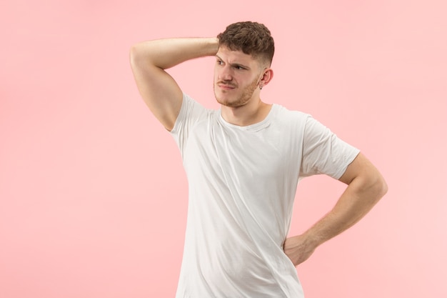 Beautiful male half-length portrait isolated on trendy pink studio