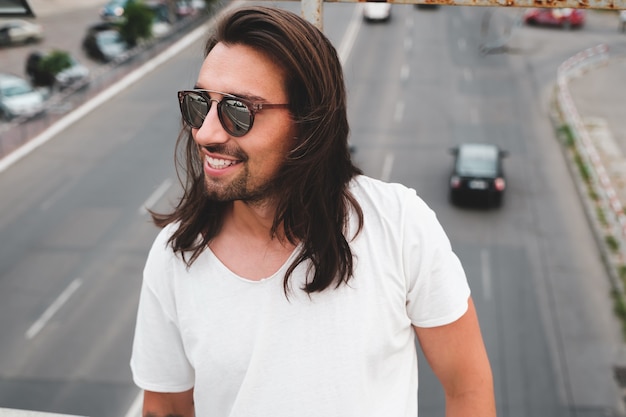 Beautiful man portrait wearing stylish sunglasses