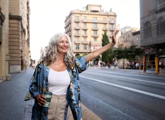 Beautiful mature woman spending time around city