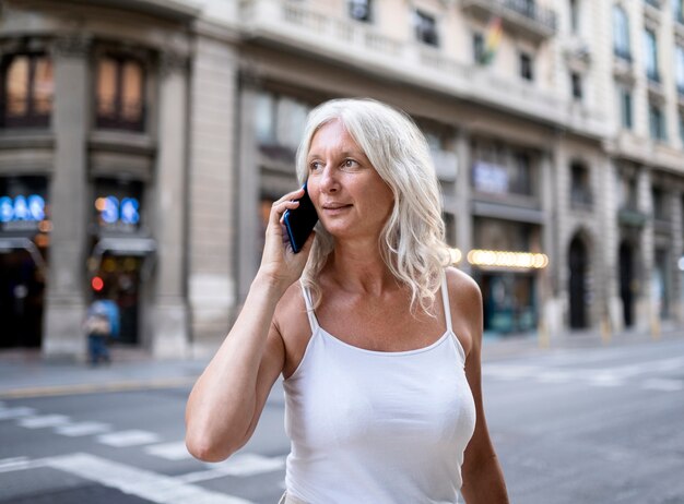 Beautiful mature woman spending time around city