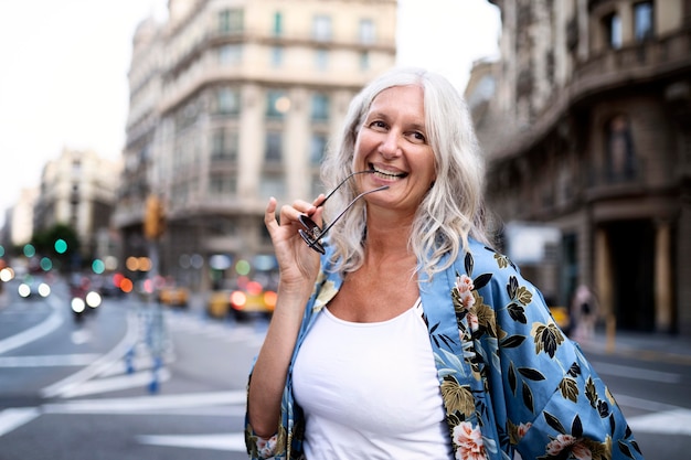 Beautiful mature woman spending time around city