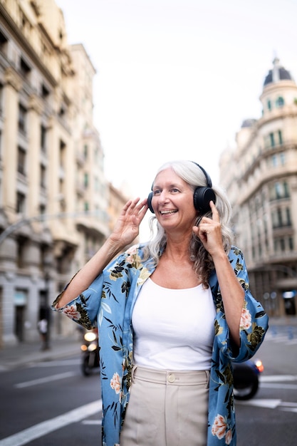 Beautiful mature woman spending time around city