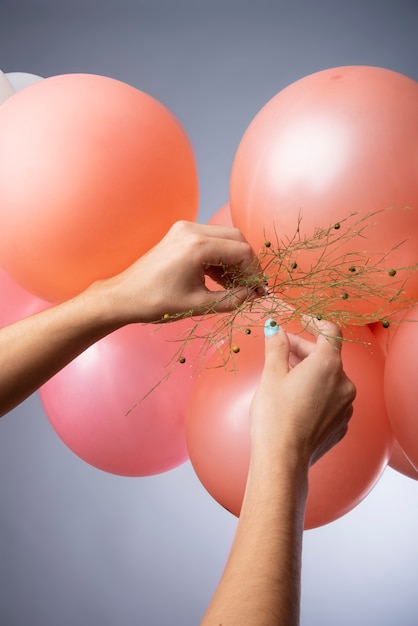 Free Photo beautiful metallic balloons with flowers