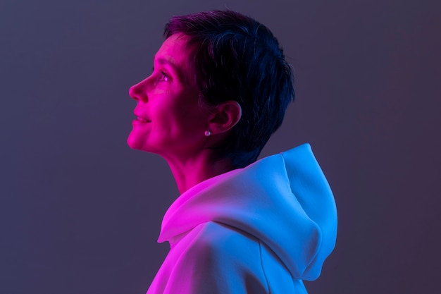 Beautiful middle aged woman in a white hoodie