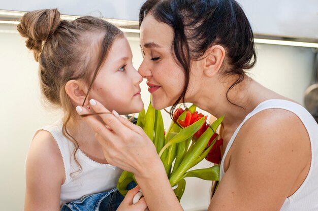 Beautiful mother and cute daughter together