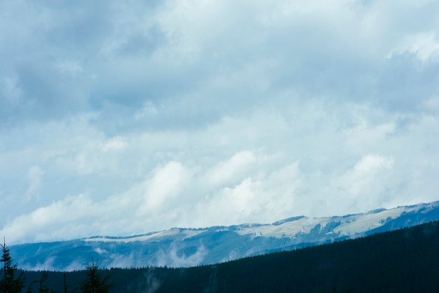 Beautiful mountain landscape with forest natural park and cloudscape