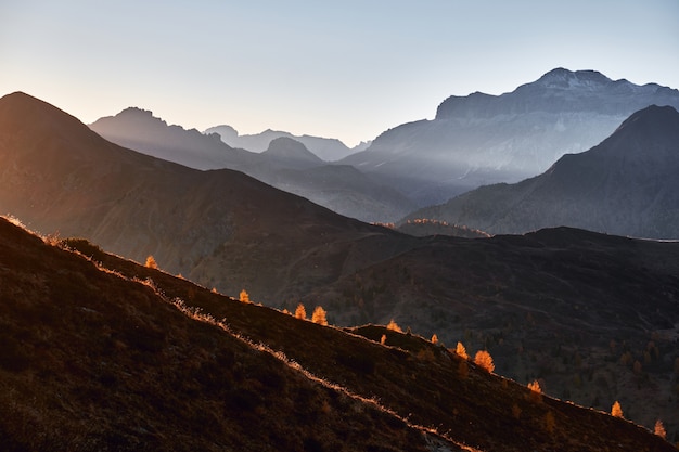 beautiful mountain plateaus and peaks with sunlight illuminating during sunset