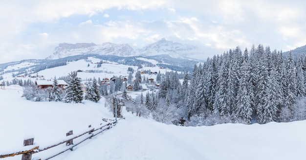 Beautiful mountains covered in snow under the cloudy sky